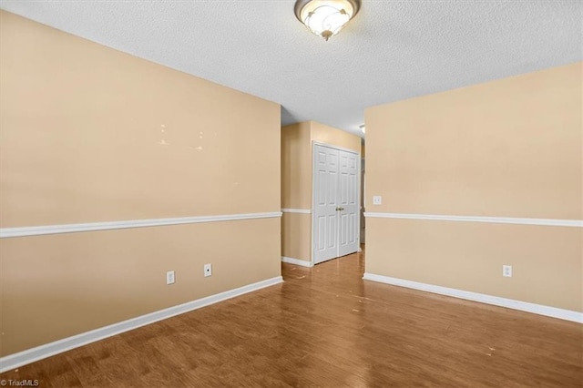 816 W Brook Ct, Archdale, NC 27263 - spare room featuring wood finished floors and a textured ceiling