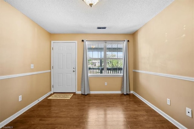 816 W Brook Ct, Archdale, NC 27263 - foyer entrance featuring a textured ceiling and wood finished floors