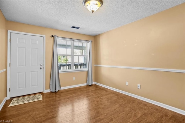 816 W Brook Ct, Archdale, NC 27263 - foyer with wood finished floors and a textured ceiling