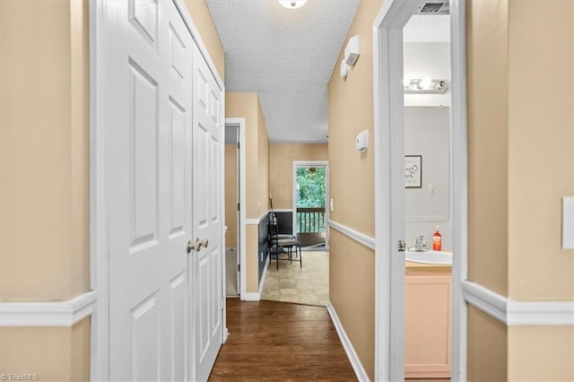 816 W Brook Ct, Archdale, NC 27263 - hall with a textured ceiling and dark wood finished floors