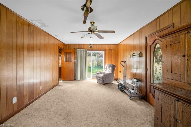 520 S Bunker Hill Rd, Colfax, NC 27235 - sitting room with wooden walls, carpet, ceiling fan, and crown molding