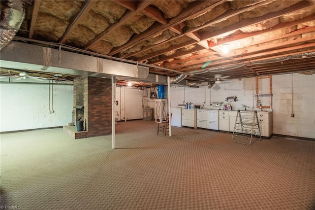 520 S Bunker Hill Rd, Colfax, NC 27235 - unfinished basement with washer and clothes dryer, a brick fireplace, and carpet floors