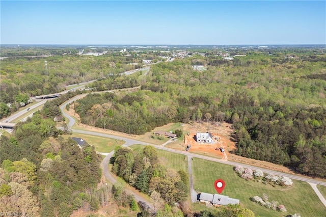 520 S Bunker Hill Rd, Colfax, NC 27235 - aerial view of property and surrounding area featuring a heavily wooded area