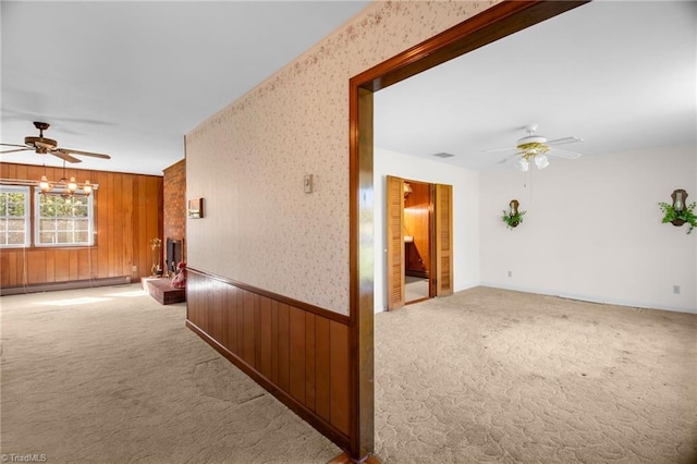 520 S Bunker Hill Rd, Colfax, NC 27235 - carpeted spare room featuring a ceiling fan, a baseboard heating unit, and wood walls