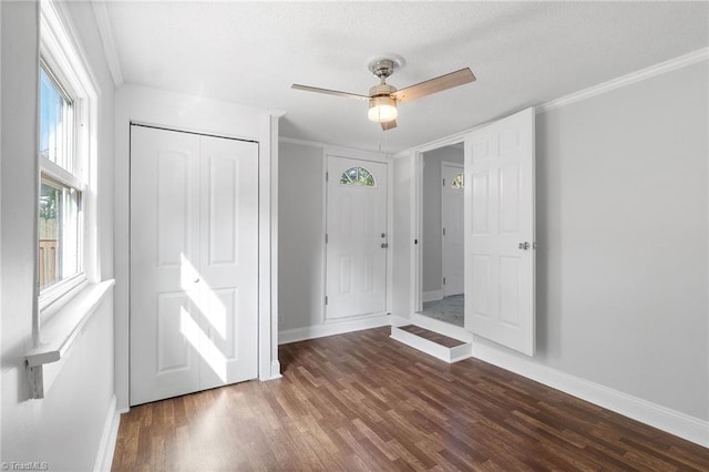 1908 Hilldale Dr, Burlington, NC 27215 - unfurnished bedroom featuring wood finished floors, a closet, crown molding, a ceiling fan, and a textured ceiling