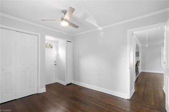 1908 Hilldale Dr, Burlington, NC 27215 - foyer entrance featuring dark wood finished floors, a ceiling fan, and ornamental molding