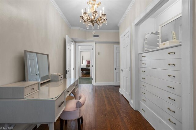 interior space featuring an inviting chandelier, dark hardwood / wood-style floors, and ornamental molding