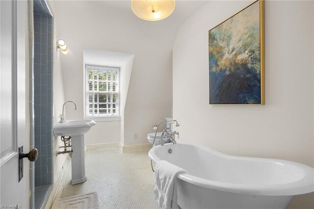 bathroom featuring tile patterned floors and a washtub