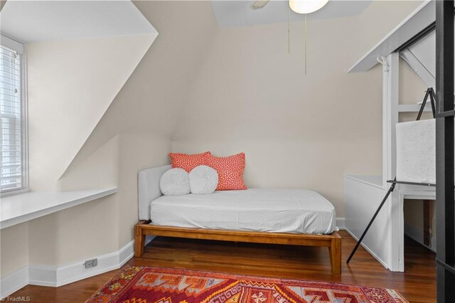 bedroom with dark wood-type flooring and ceiling fan