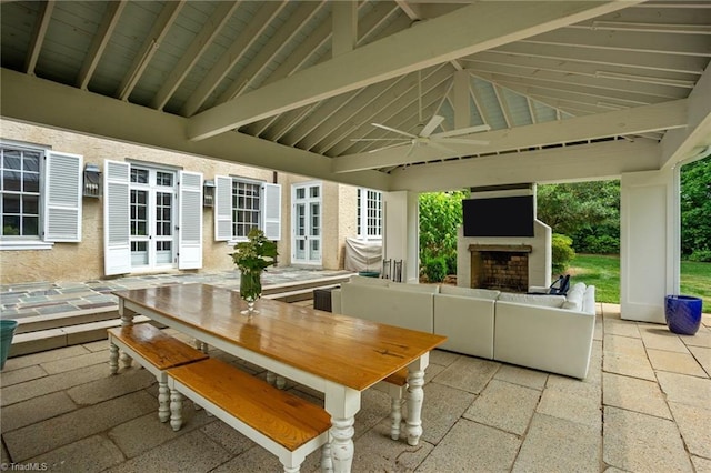 view of patio / terrace featuring a gazebo and an outdoor fireplace