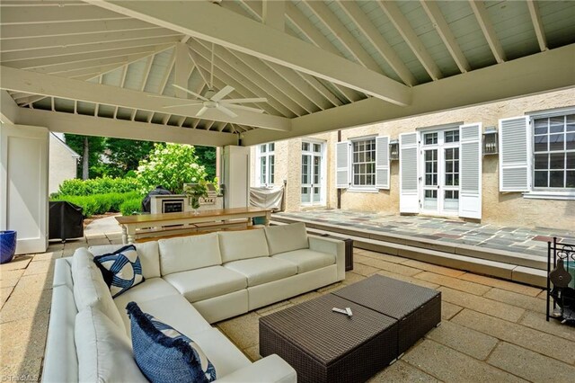 view of patio with an outdoor living space, ceiling fan, and french doors