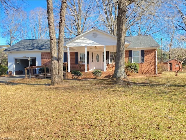 ranch-style house featuring a garage, a porch, and a front yard