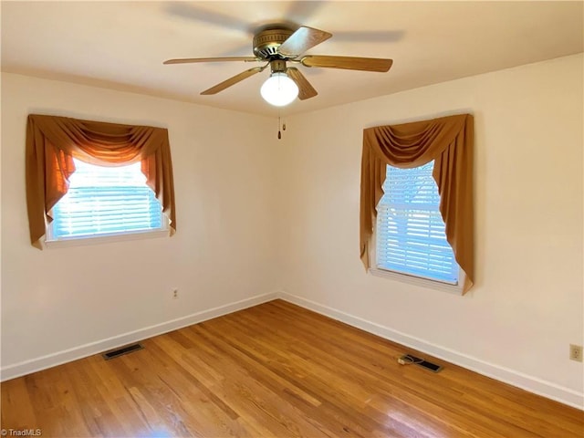 spare room featuring ceiling fan and wood-type flooring