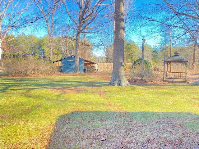 view of yard with an outbuilding and a gazebo