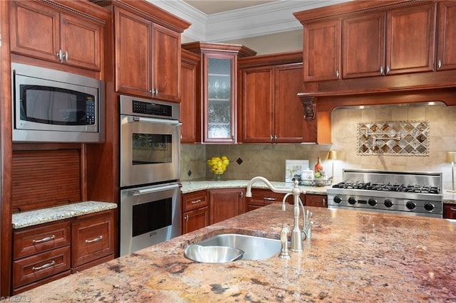 kitchen featuring sink, decorative backsplash, custom exhaust hood, stainless steel appliances, and crown molding