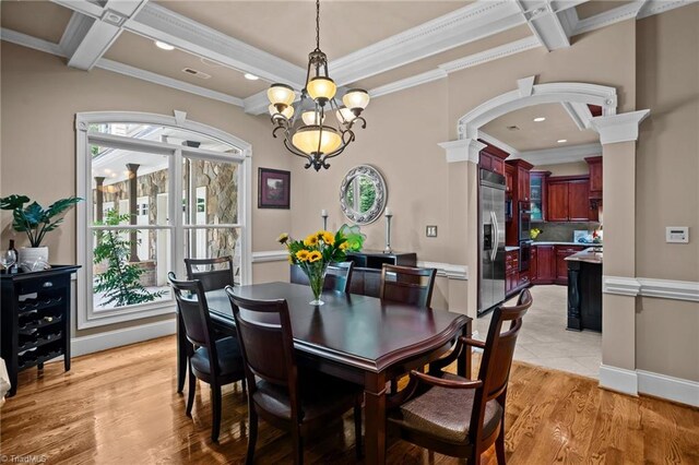 dining room with ornamental molding, coffered ceiling, beam ceiling, and light hardwood / wood-style flooring