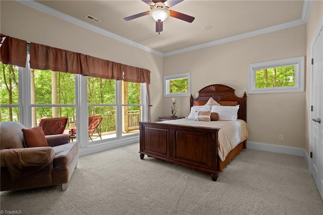 bedroom with light colored carpet, ornamental molding, and multiple windows