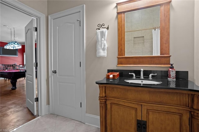 bathroom featuring pool table, vanity, and tile patterned flooring