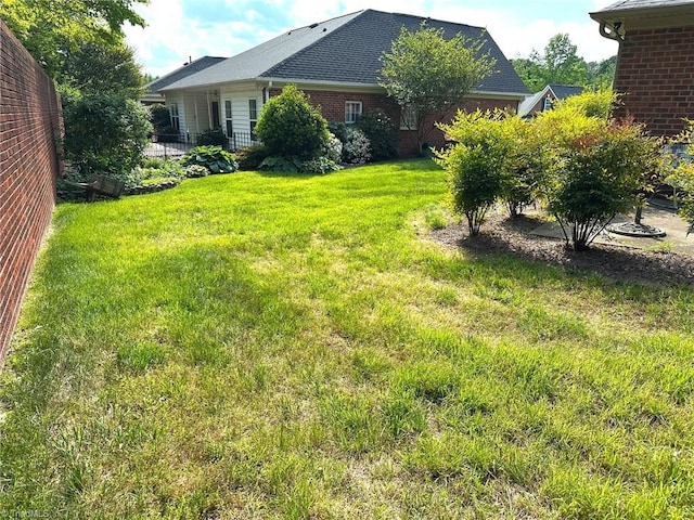 view of yard featuring fence