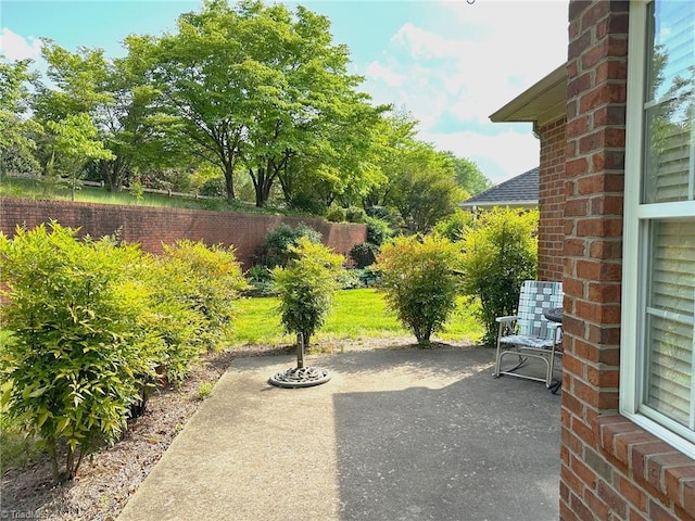 view of patio featuring fence