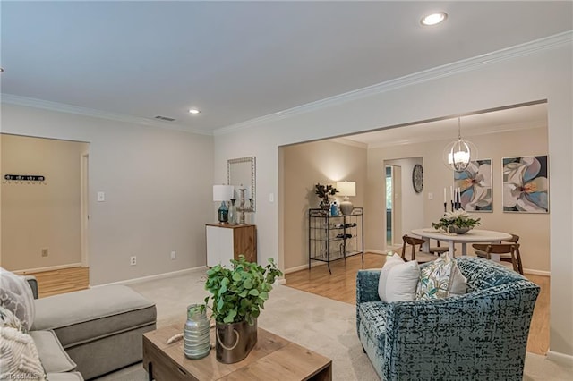 living room with light carpet, ornamental molding, baseboards, and recessed lighting