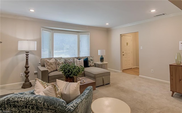 living room featuring light colored carpet, ornamental molding, baseboards, and recessed lighting