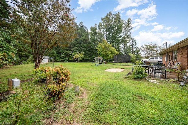 view of yard featuring a trampoline