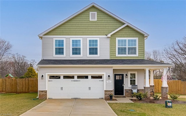 craftsman-style house featuring a front yard, fence, concrete driveway, and brick siding