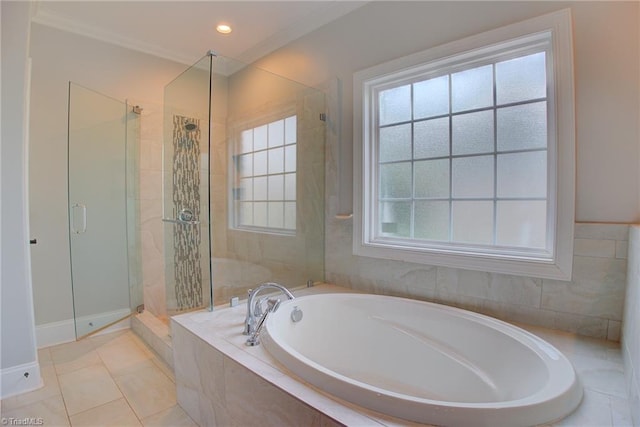 bathroom with plenty of natural light, tile patterned flooring, and separate shower and tub