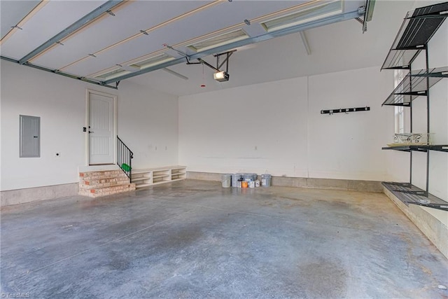 garage featuring electric panel and a garage door opener