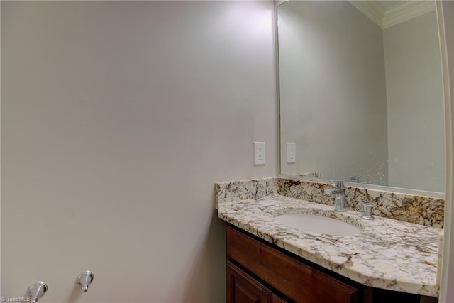 bathroom with vanity and crown molding