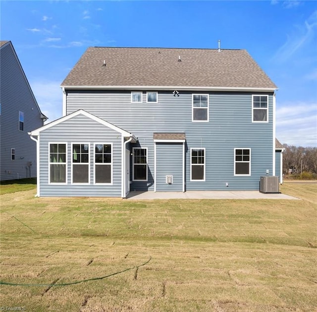 back of property featuring central air condition unit, a patio, and a yard