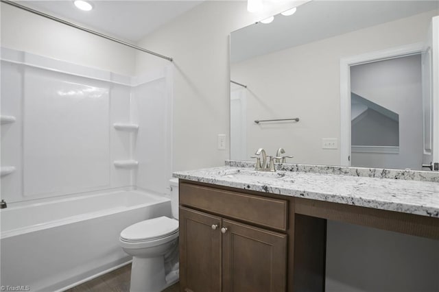 full bathroom with vanity, hardwood / wood-style flooring, toilet, and shower / bathtub combination