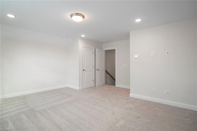 spare room with light colored carpet