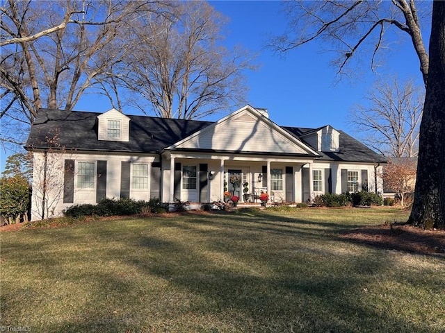 view of front of home featuring a front yard and a porch