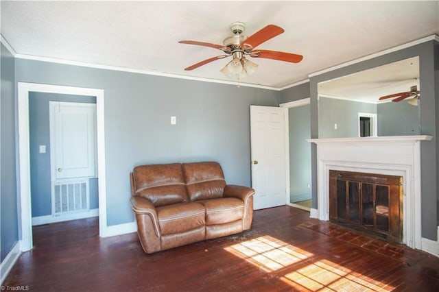 unfurnished living room featuring ornamental molding, dark hardwood / wood-style floors, and ceiling fan