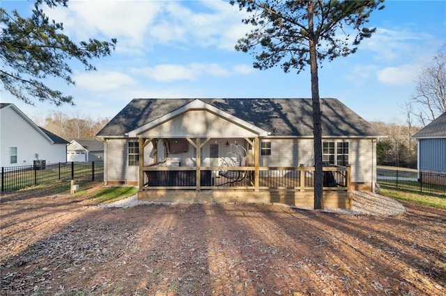 view of front facade with fence and a deck