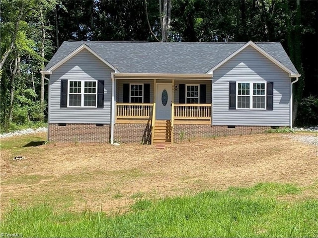 661 Apache Dr, Winston-Salem, NC 27107 - ranch-style house featuring crawl space, covered porch, a front lawn, and roof with shingles