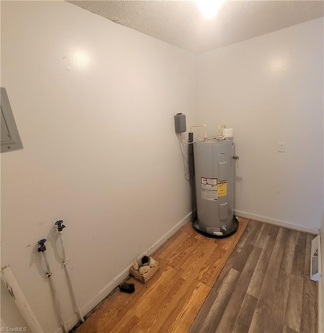 utility room with electric water heater