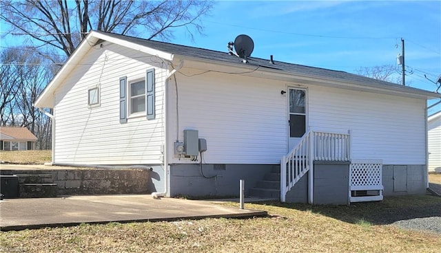 back of property with crawl space and a patio