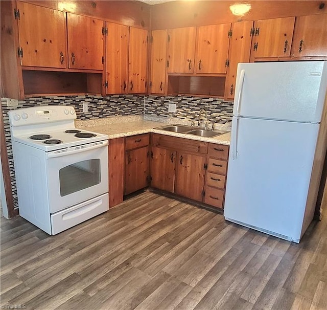 kitchen with open shelves, white appliances, light countertops, and a sink