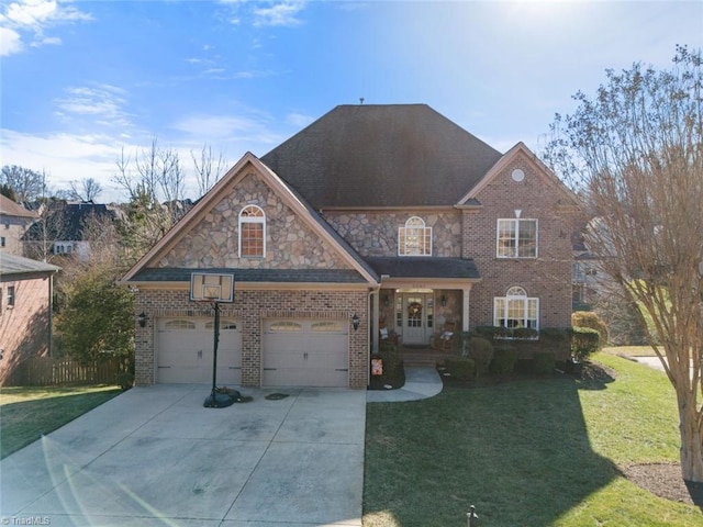 view of front property with a garage and a front yard