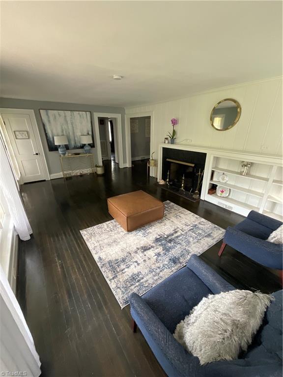 621 N Craige St, Salisbury, NC 28144 - living room featuring wood finished floors and a fireplace