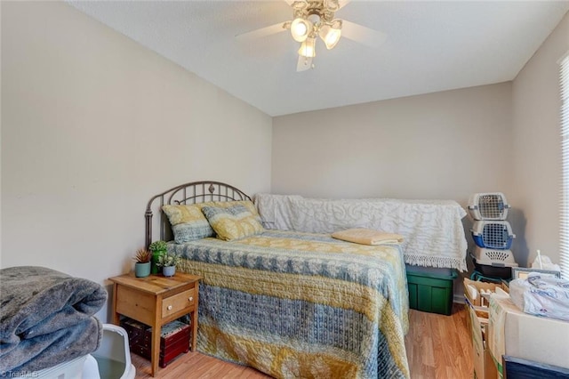 bedroom featuring light wood-type flooring and ceiling fan