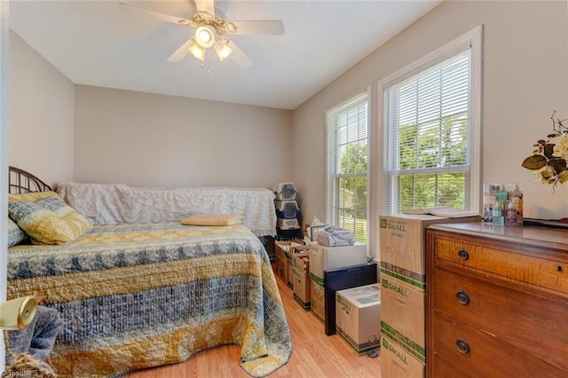 bedroom featuring light wood-style floors and ceiling fan