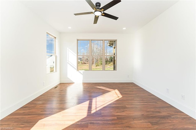 unfurnished room featuring dark hardwood / wood-style floors and ceiling fan