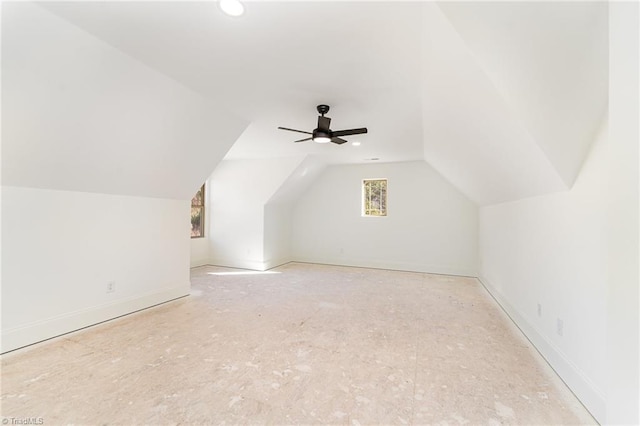 additional living space with ceiling fan and vaulted ceiling