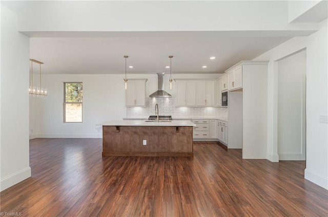 8812 Rudy Dr, Kernersville, NC 27284 - kitchen featuring wall chimney exhaust hood, dark wood-style floors, decorative backsplash, white cabinetry, and open floor plan