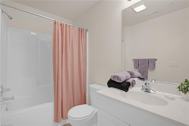 full bathroom featuring shower / bathtub combination with curtain, vanity, and toilet