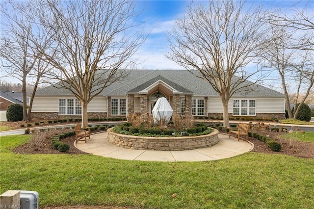 ranch-style house with a front lawn